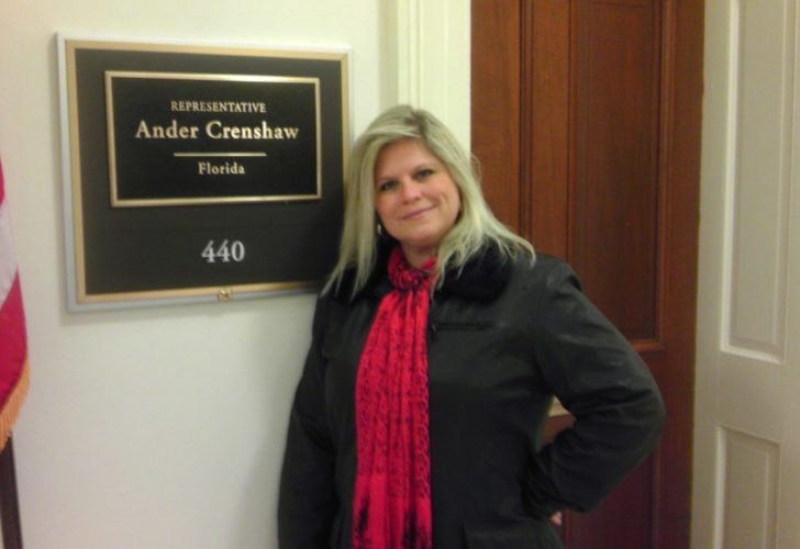 Donna Fogle in front of Ander Crenshaw's office