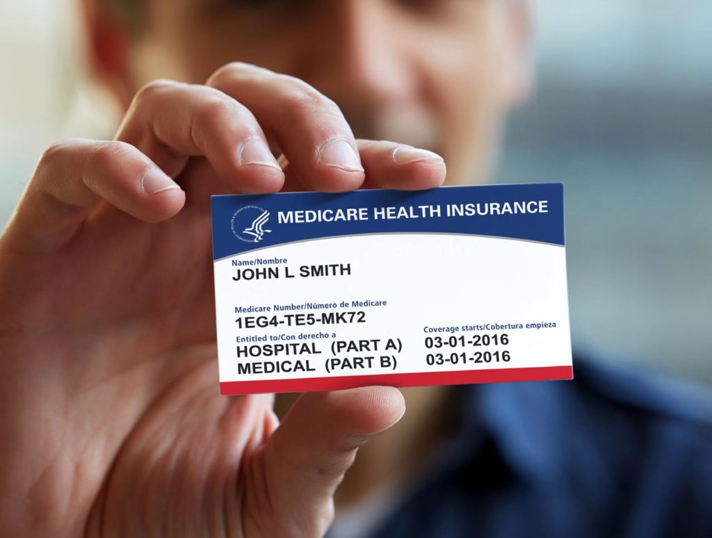 Person holding up the new 2018 Medicare card
