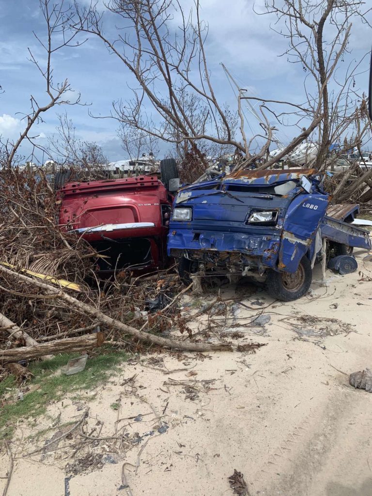 A car and a truck completely totaled by Hurricane Dorian on Elbow Cay