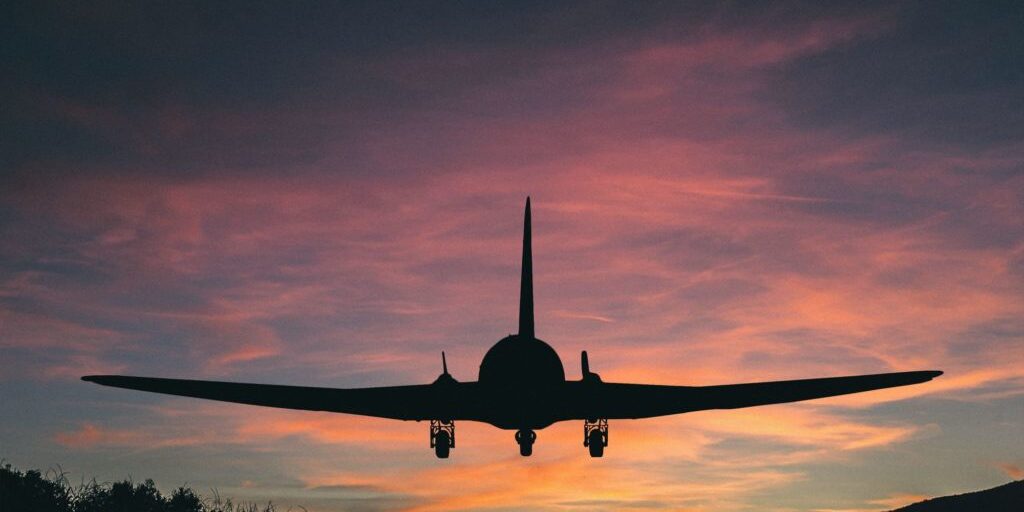 Airplane landing on a runway.